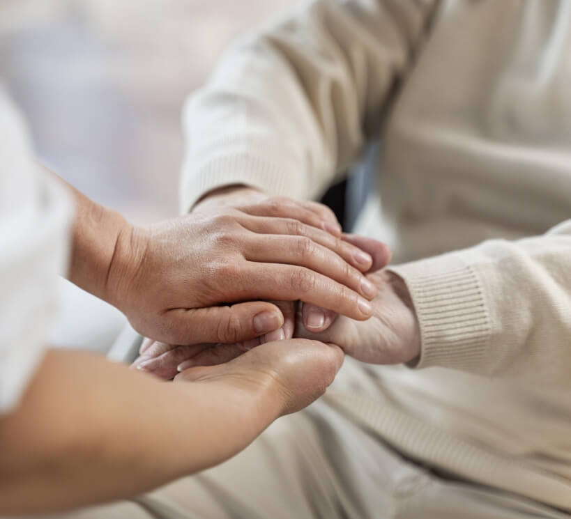 doctor-holding-hands-with-senior-patient
